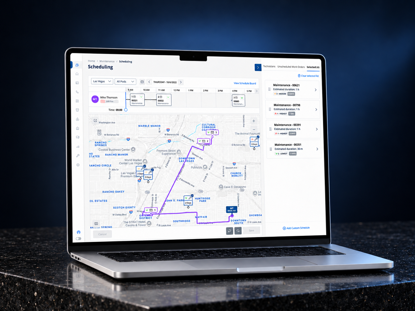 AMH Scheduling displayed on a laptop against a dark blue background and granite surface, showing the technician timeline, mapped route and selected work orders.